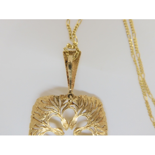 787 - A 9ct gold retro pendant with London import marks dated 1972, weight 7.2gms, with a 14k gold figaro ... 