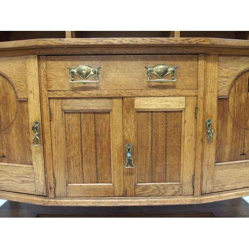 2015A - AN EARLY 20TH CENTURY BLONDE OAK ARTS & CRAFTS SIDEBOARDwith carved pierced motif over three ope... 