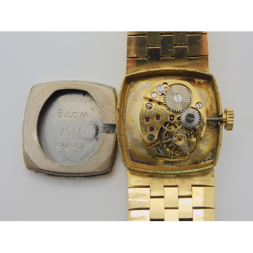 2895 - TWO BULOVA WATCHESa ladies gold plated example with gold coloured dial, baton numerals and hands. Wi... 