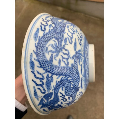 2392 - A CHINESE CELADON GLAZED BOWL Carved with foliage, 19.5cm diameter and a blue and white dragon bowl,... 