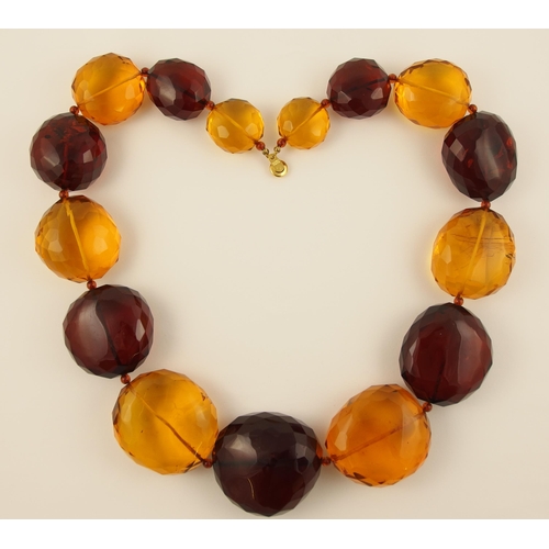 100 - Item 5. A very large orange and cherry amber coloured statement necklace