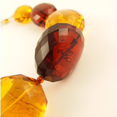 100 - Item 5. A very large orange and cherry amber coloured statement necklace