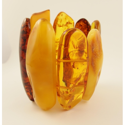 101 - Item 6. A very large yellow and orange amber coloured statement bracelet