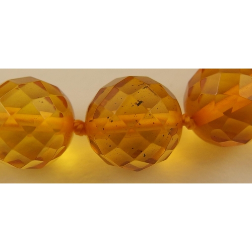 102 - Item 7. A very long diamond yellow amber coloured festoon statement necklace