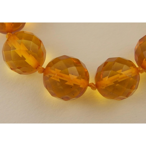 102 - Item 7. A very long diamond yellow amber coloured festoon statement necklace