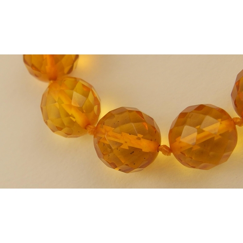 102 - Item 7. A very long diamond yellow amber coloured festoon statement necklace