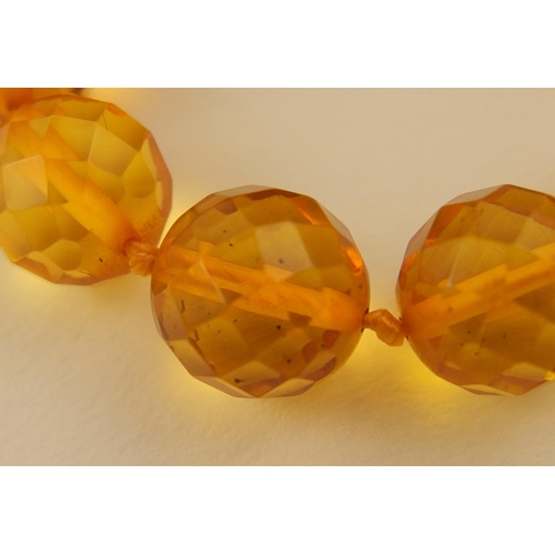 102 - Item 7. A very long diamond yellow amber coloured festoon statement necklace