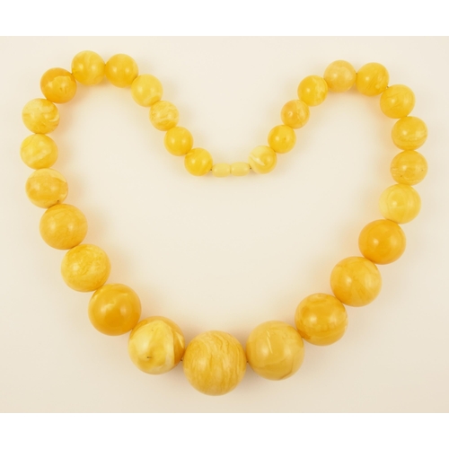 103 - Item 8. A large royal amber coloured necklace