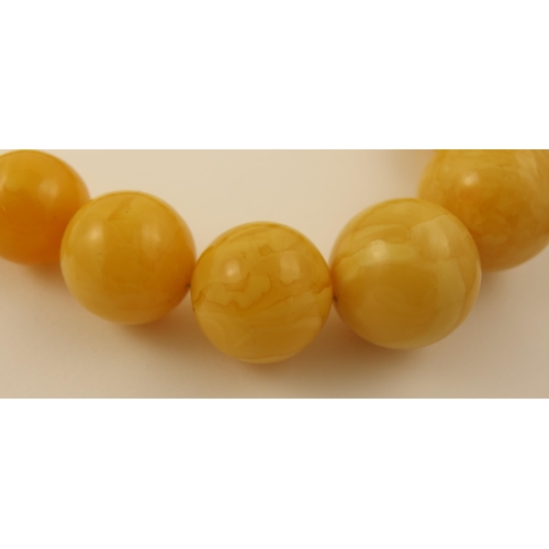 103 - Item 8. A large royal amber coloured necklace