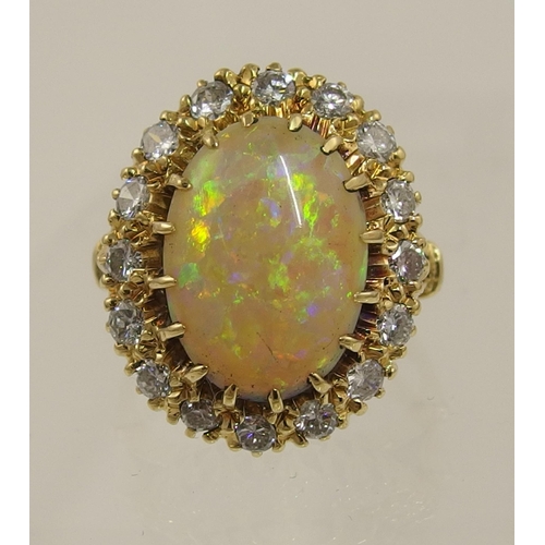 119 - An 18ct yellow gold opal and diamond ring