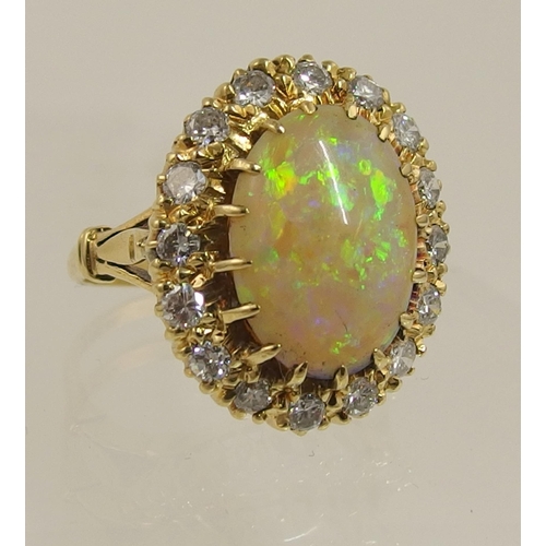 119 - An 18ct yellow gold opal and diamond ring