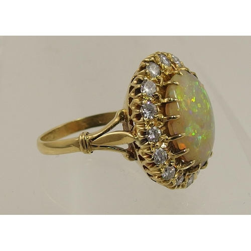 119 - An 18ct yellow gold opal and diamond ring