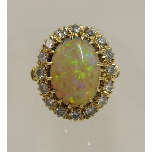 119 - An 18ct yellow gold opal and diamond ring