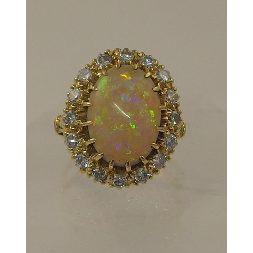 119 - An 18ct yellow gold opal and diamond ring