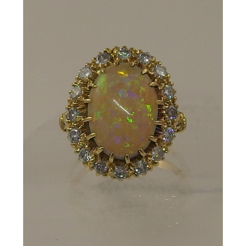 119 - An 18ct yellow gold opal and diamond ring