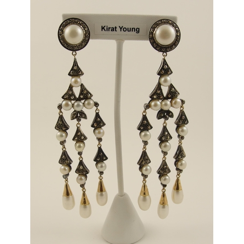 123 - A pair of diamond and pearl earrings