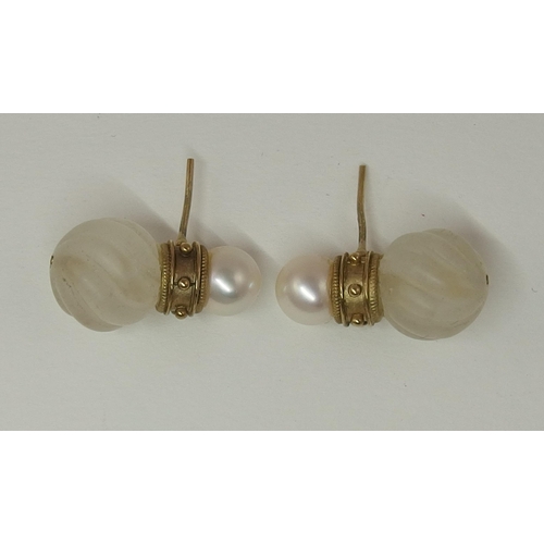 138 - A pair of earrings attributed to