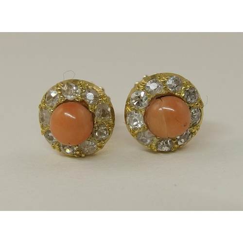 150 - A pair of coral and diamond earrings