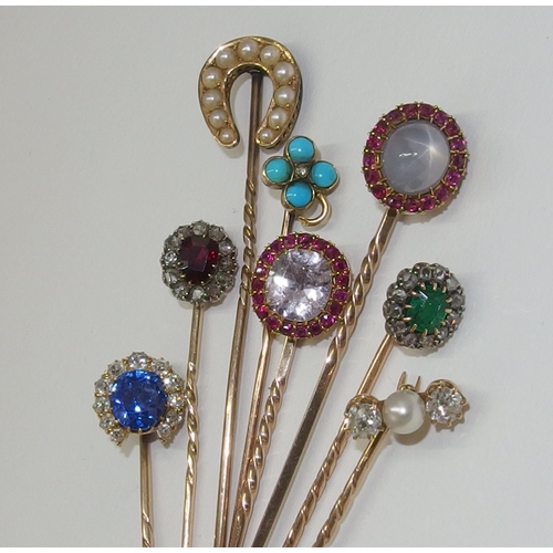 156 - A collection of eight stick pins