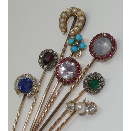 156 - A collection of eight stick pins