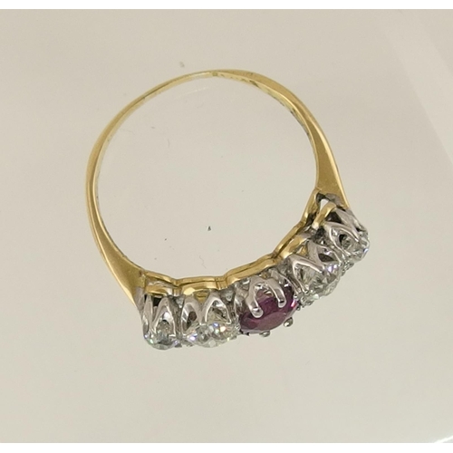 165 - A yellow metal diamond and pink gem ring