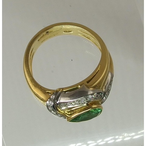 169 - An 18ct emerald and diamond ring