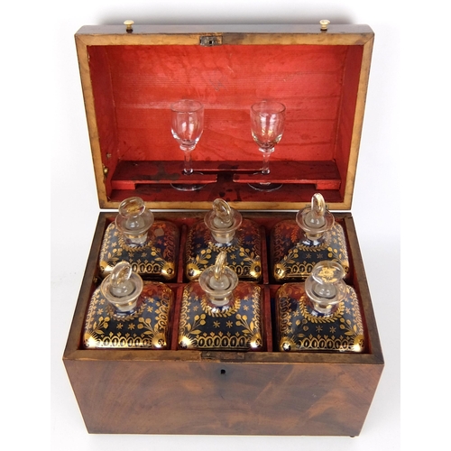 300 - A 19th Century mahogany domed decanter box