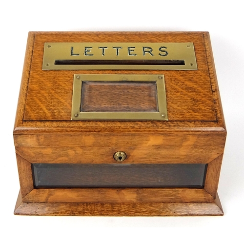 302 - An Edwardian oak letter box