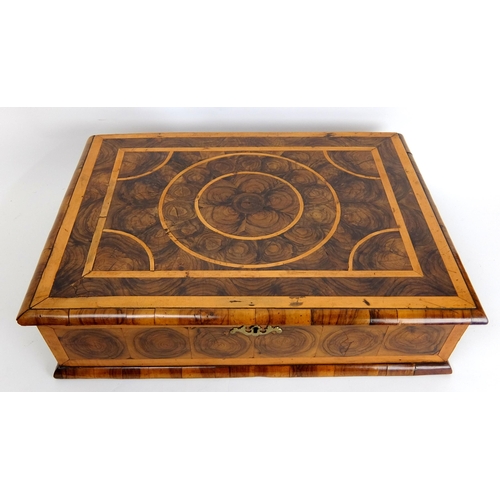 315 - A walnut oyster veneered rectangular dressing table box in the 17th Century style