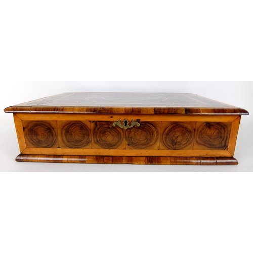 315 - A walnut oyster veneered rectangular dressing table box in the 17th Century style