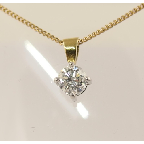 63 - An 18ct solitaire diamond pendant