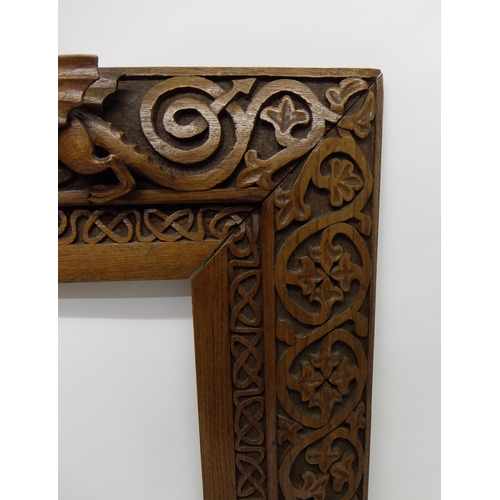 702 - Manner of ALEXANDER RITCHIE an elaborately carved oak picture frame