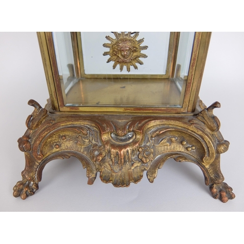 710 - A French Rococo style gilt metal mounted mantle clock