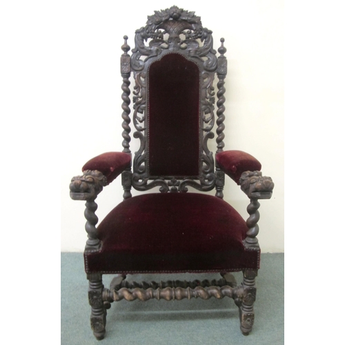 812 - A 20th Century carved oak open armchair in the Jacobean style