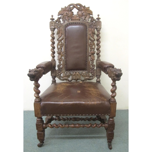 813 - A 20th Century carved oak open armchair in the Jacobean style