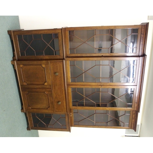 830 - A late 19th Century mahogany inlaid breakfront bookcase