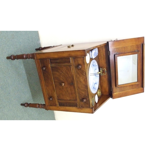 831 - A Victorian mahogany washstand modelled as a writing bureau