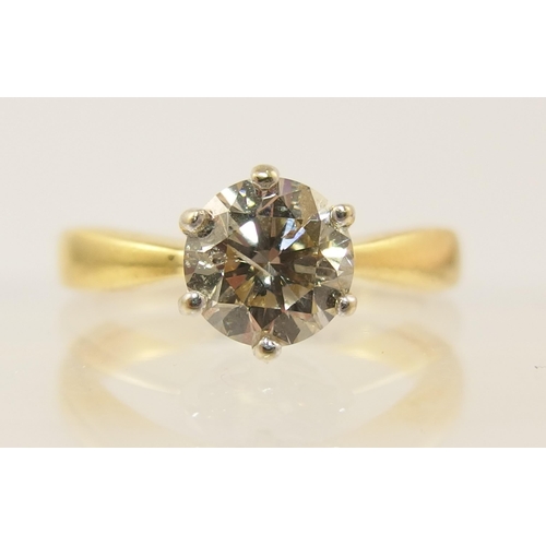 89 - An 18ct yellow and white gold solitaire diamond ring