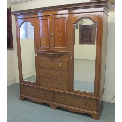 891 - An Edwardian mahogany inlaid princess wardrobe