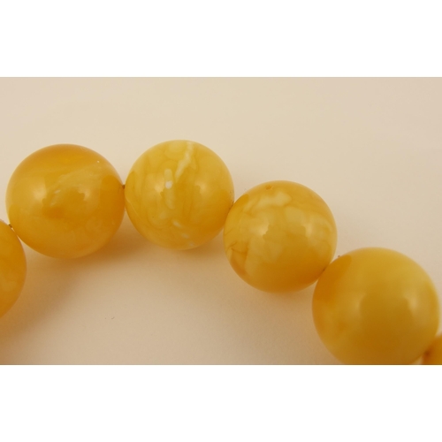 96 - Item 1. A royal amber coloured necklace