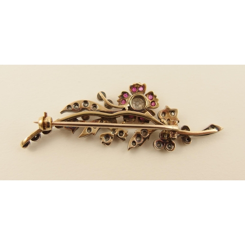 12 - An early Victorian diamond and ruby flower brooch