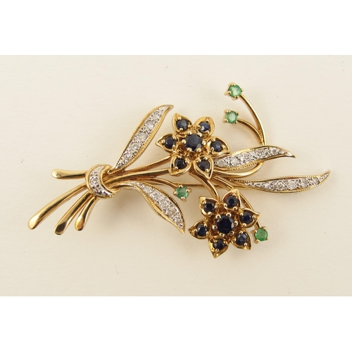 120 - A yellow metal brooch set with diamonds  sapphires and emeralds