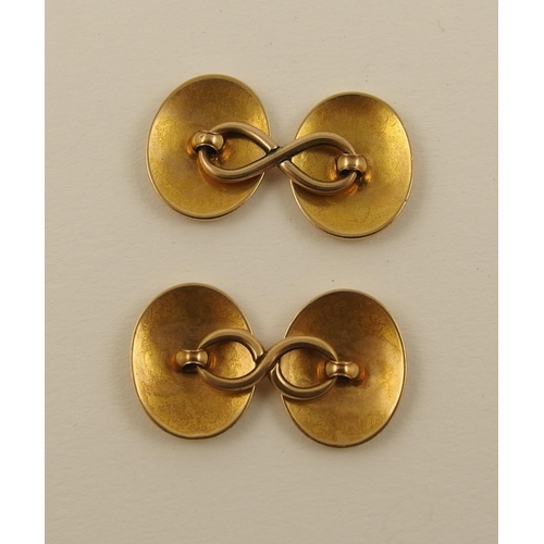 133 - A pair of yellow metal heraldic cufflinks