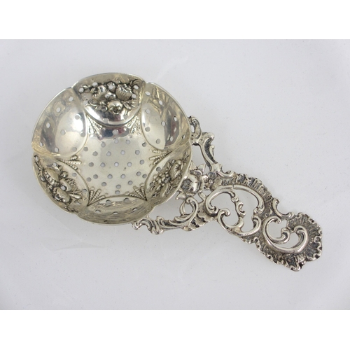 155 - An 18th Century silver sifter spoon