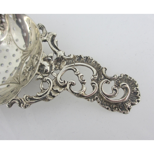 155 - An 18th Century silver sifter spoon