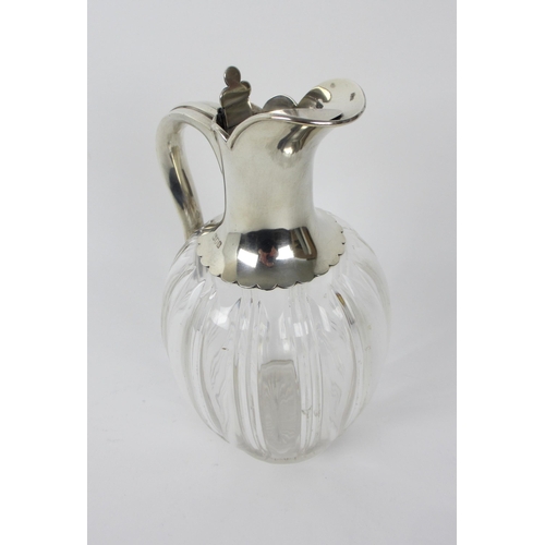 161 - A silver topped claret jug