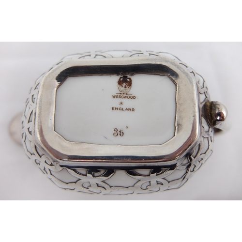 163 - A three piece silver overlaid porcelain tea service