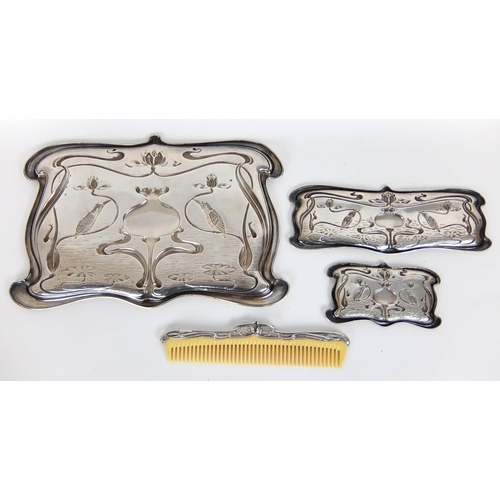 178 - An Art Nouveau silver ten piece dressing table set