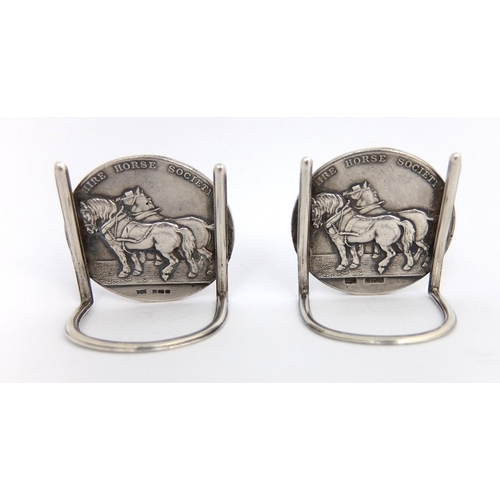 183 - A pair of silver menu-holders