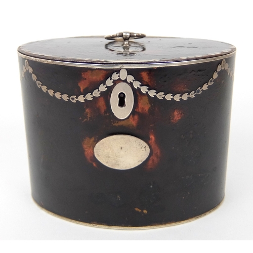 184A - A faux tortoiseshell tea caddy of oval shape